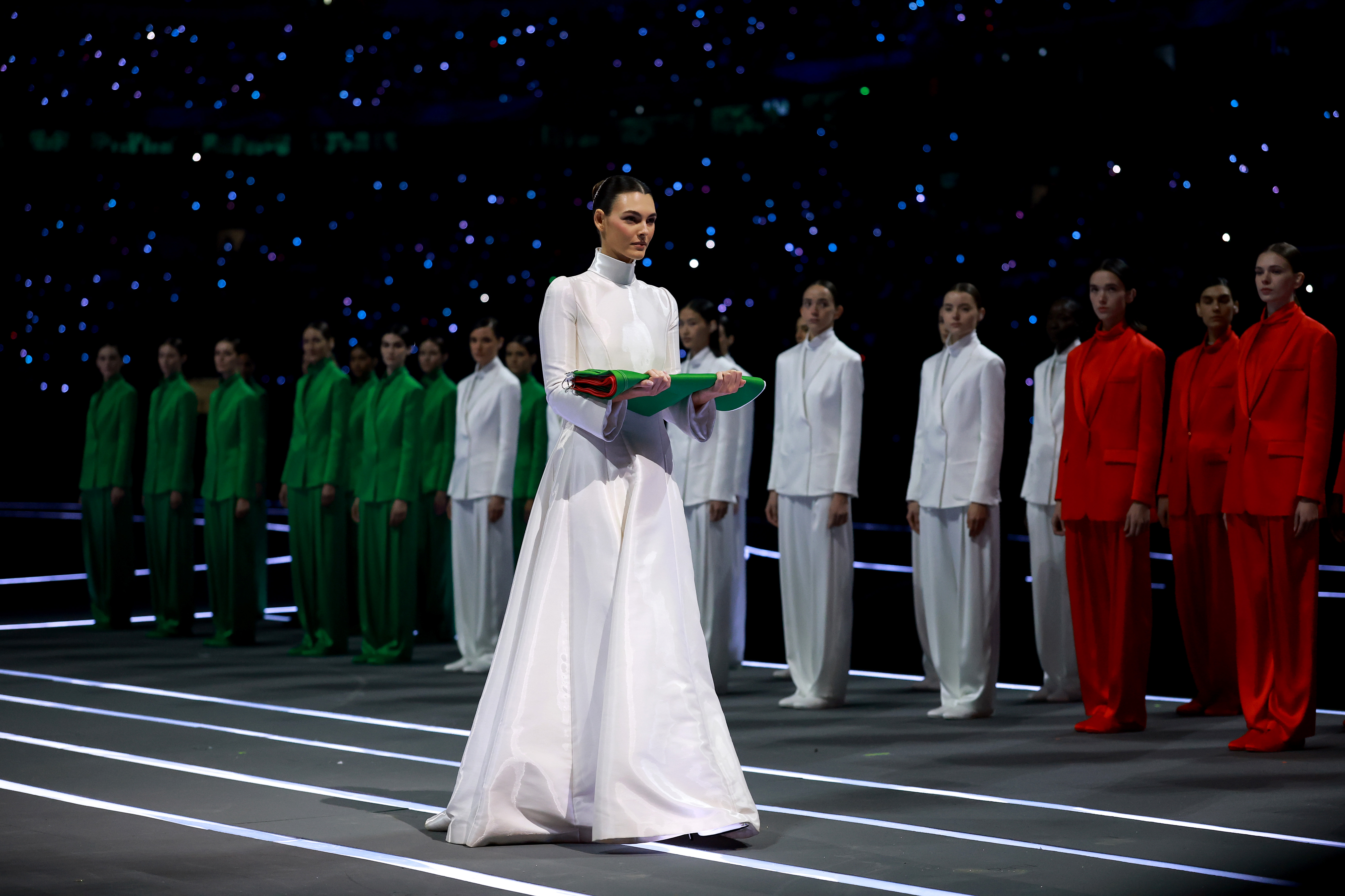 MILAN, ITALY - FEBRUARY 06: Vittoria Ceretti, flagbearer for Milano, caries the Italian flag during the opening ceremony of the Milano Cortina 2026 Winter Olympics at San Siro Stadium on February 06, 2026 in Milan, Italy.
