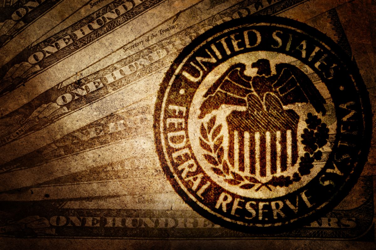 Federal Reserve insignia on overlaid on money