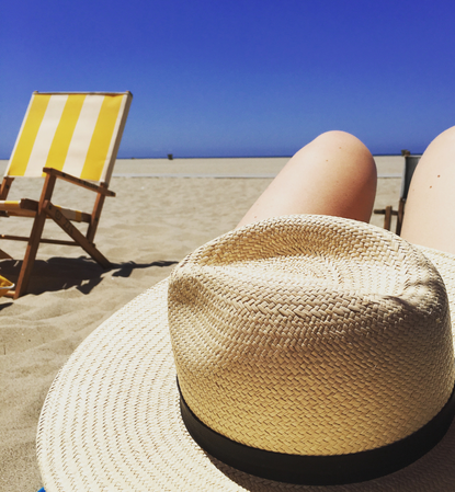 Brooke Ely Danielson wearing a straw summer hat