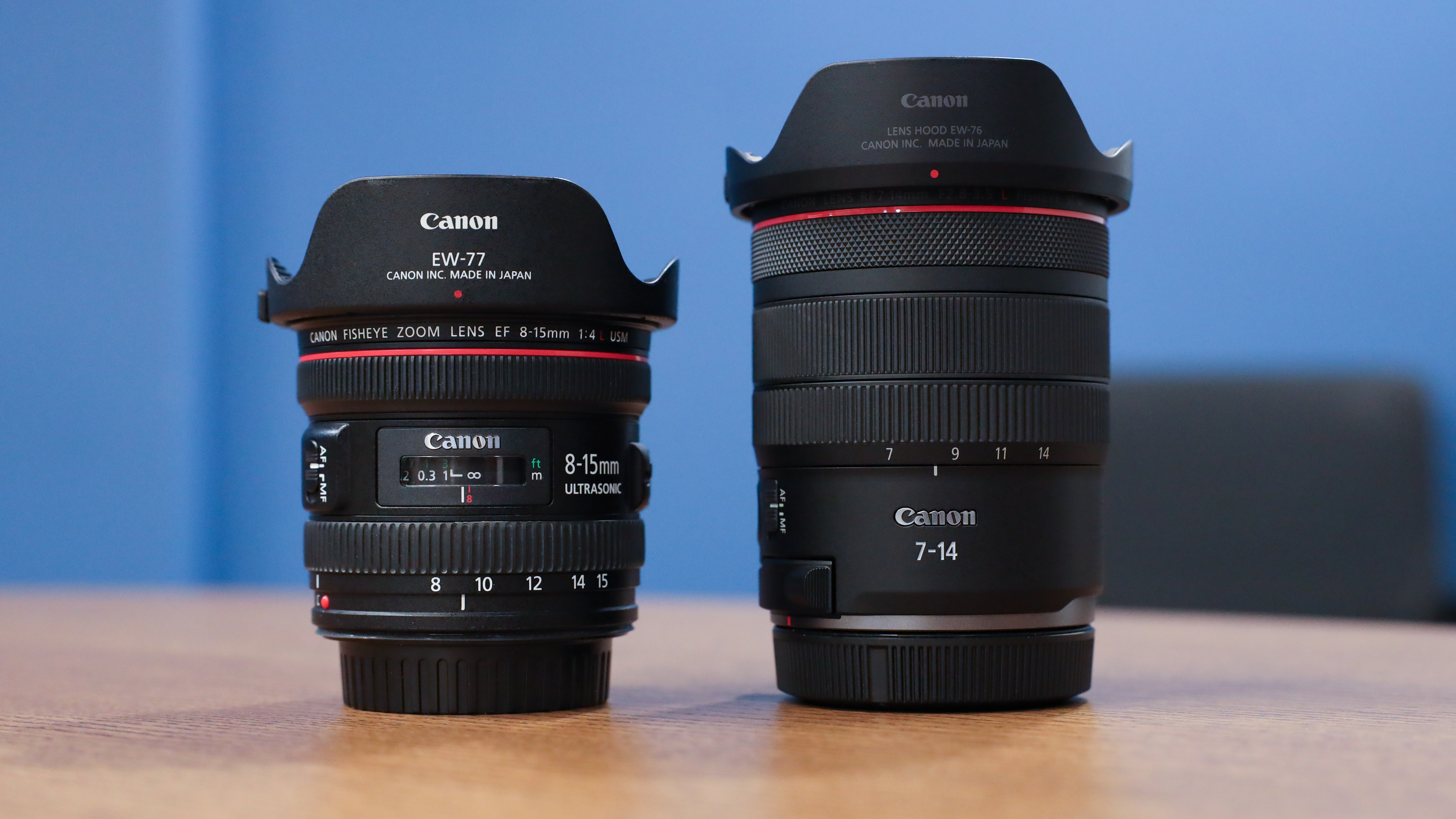 Canon EF 8-15mm f/4L USM lens next to a Canon RF 7-14mm f/2.8-3.5L Fisheye STM lens