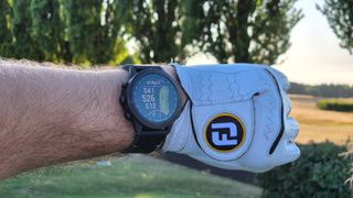 The Garmin MARQ Golfer (Gen 2) being worn on the wrist on the golf course