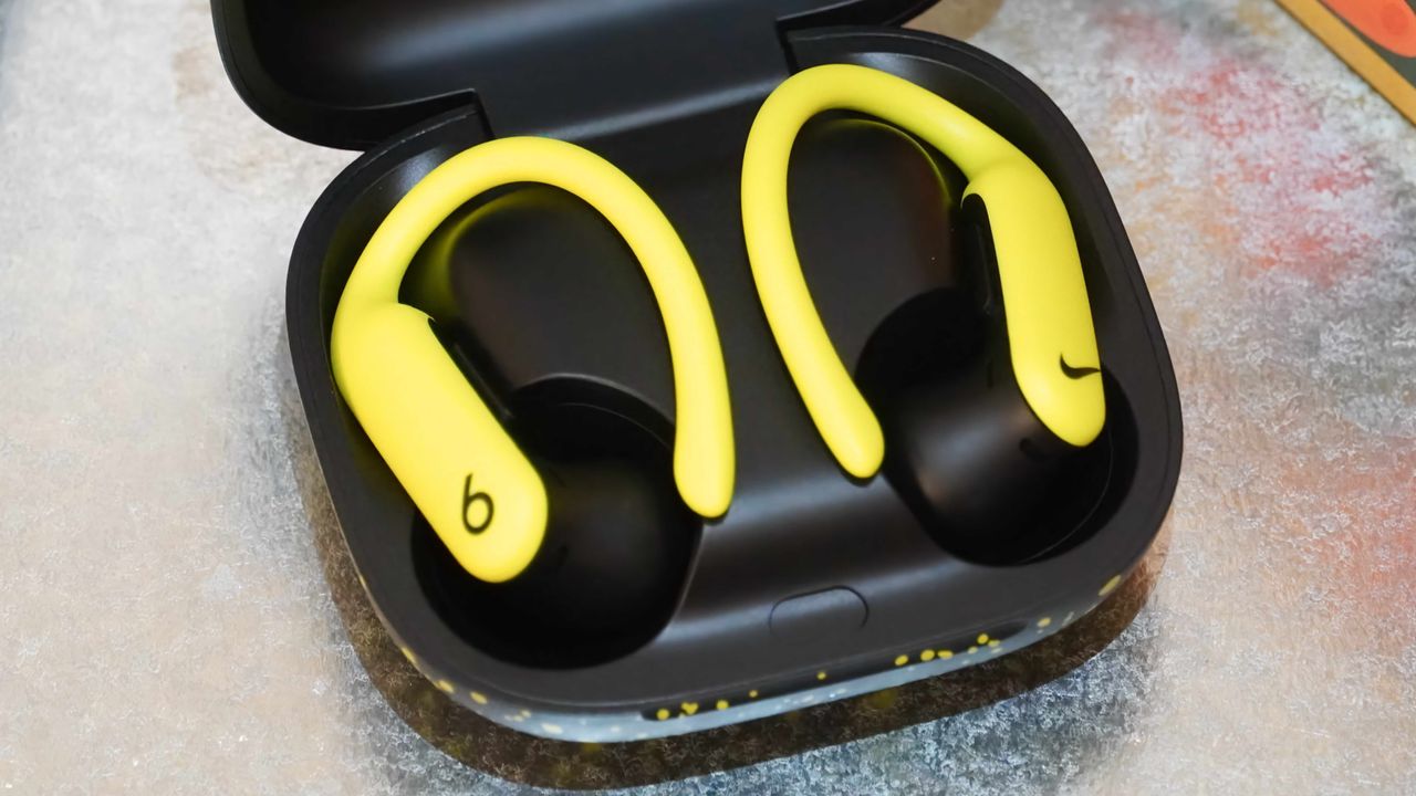 The Nike Special Edition variant of the Powerbeats Pro 2 in a volt and matte black colorway.