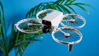 A gray DJI Flip drone with propeller guards