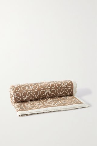 a light brown and off-white printed beach towel