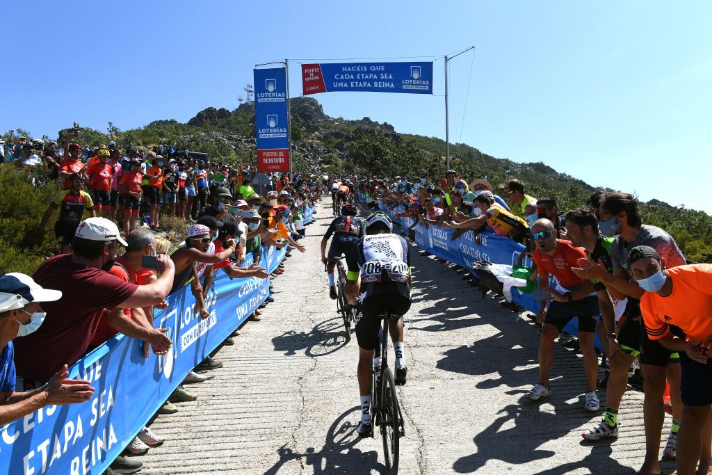 PICO VILLUERCAS SPAIN AUGUST 28 A general view of Thomas Pidcock of United Kingdom and Team INEOS Grenadiers and Dylan Sunderland of Australia and Team Qhubeka Nexthash beginning to climb the Alto Collado de Ballesteros 1415m while fans cheer during the 76th Tour of Spain 2021 Stage 14 a 1657km stage from Don Benito to Pico Villuercas 1580m lavuelta LaVuelta21 on August 28 2021 in Pico Villuercas Spain Photo by Tim de WaeleGetty Images
