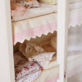 cupboard with shelf and clothes