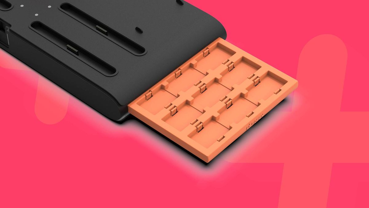 Official promo images of the DLX2 + LED Multi-Function Charge Stand, with a pink GamesRadar+ background.