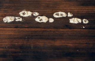 foot prints in flour on wooden floor