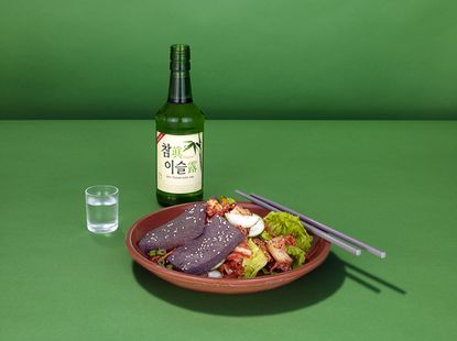 ﻿Maemil (Buckwheat) with a bottle of Sake next to it