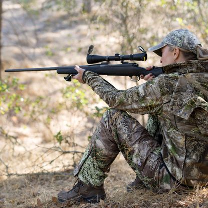 Soldier, Military person, Military camouflage, Military uniform, Rifle, Camouflage, Gun, Shoe, Firearm, Joint, 