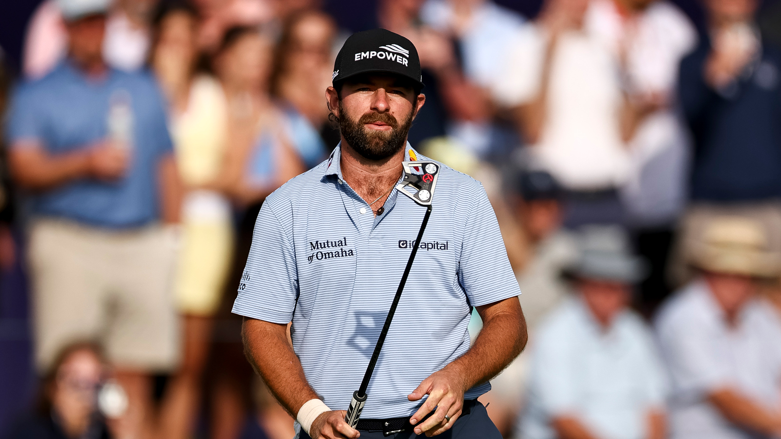 Cameron Young reacts to a putt on the green