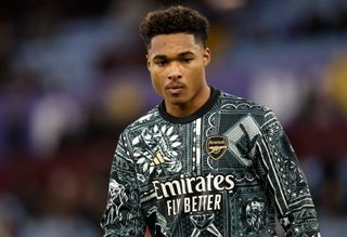 Reuell Walters of Arsenal warms up before the Premier League match between Aston Villa and Arsenal FC at Villa Park on December 9, 2023 in Birmingham, England.