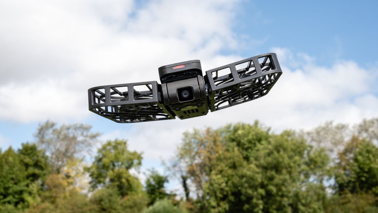 a small drone hovers in the air