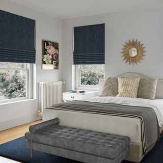 white bedroom with velvet blinds and grey bedding