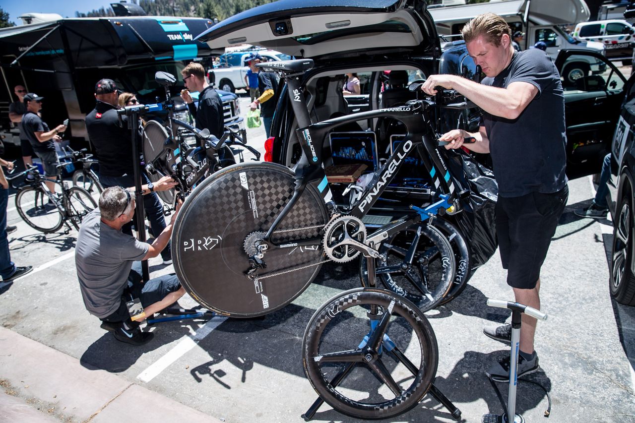 Mechanic Thomas Kousgaard files Ian Boswell's front brake pads ahead of the time trial