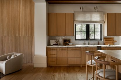 A kitchen with wooden pulls