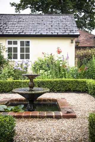 fountain in cottage style garden