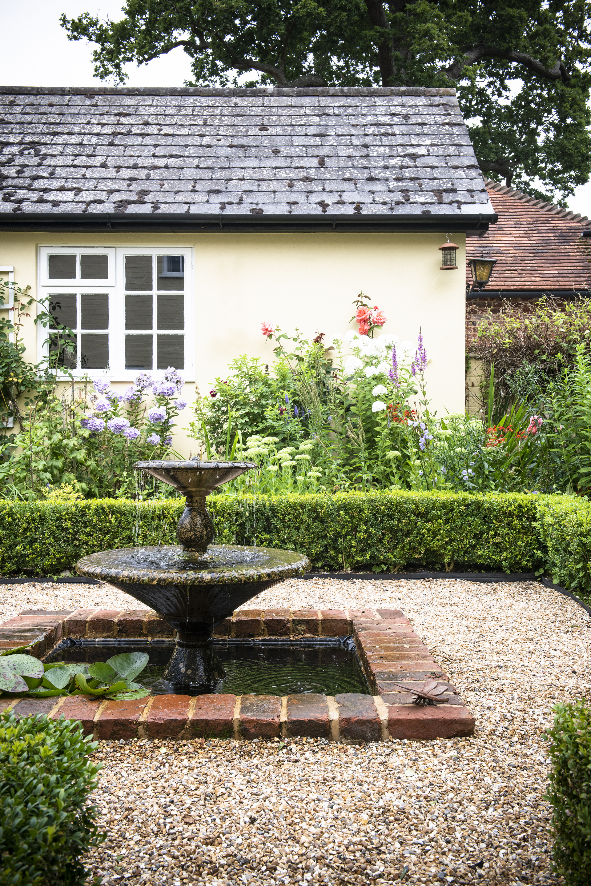 fountain in cottage style garden