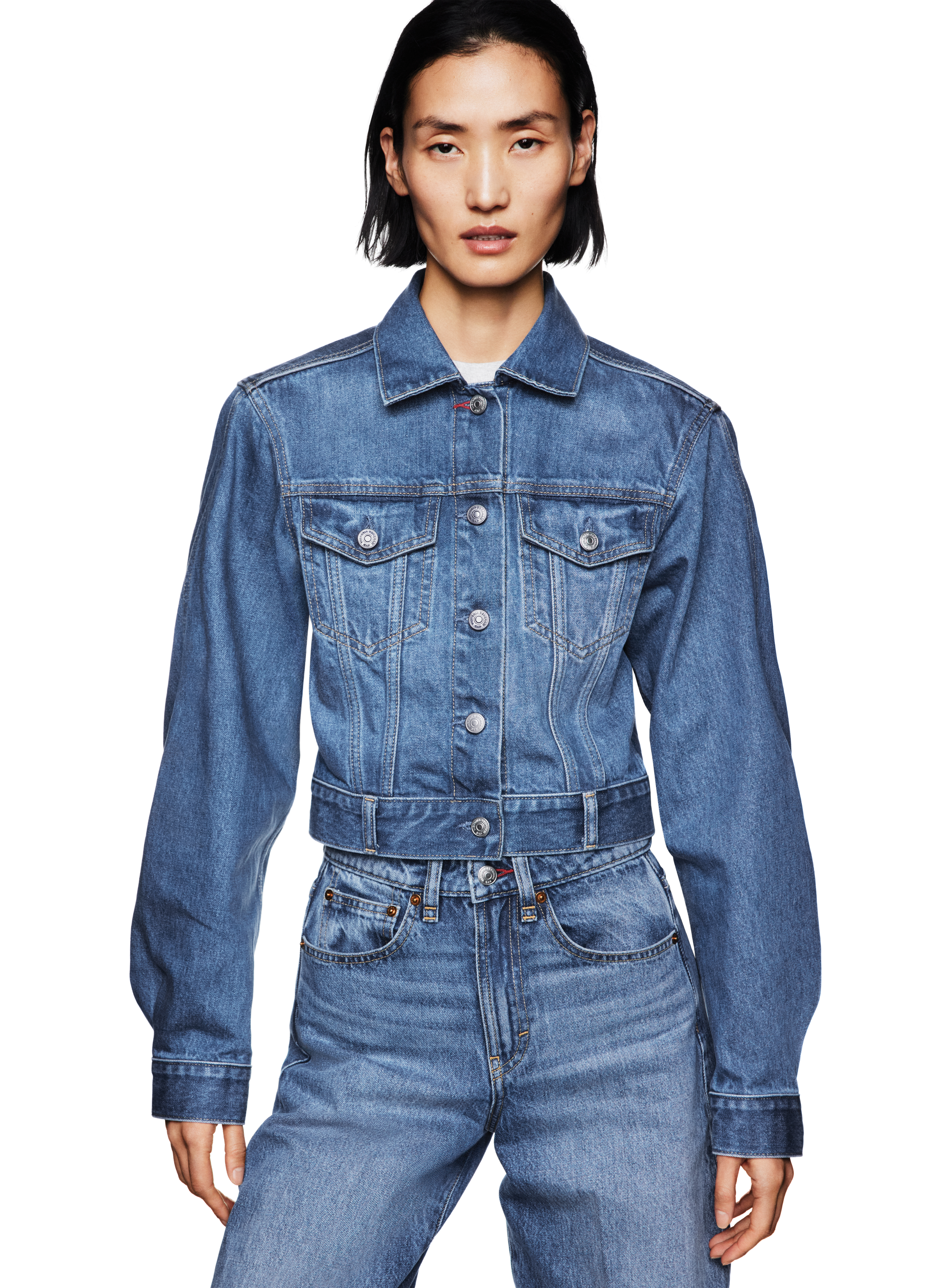 a model wearing a gap cropped jacket and jeans