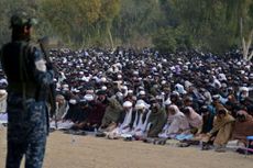 Taliban fighter observing Muslim prayers