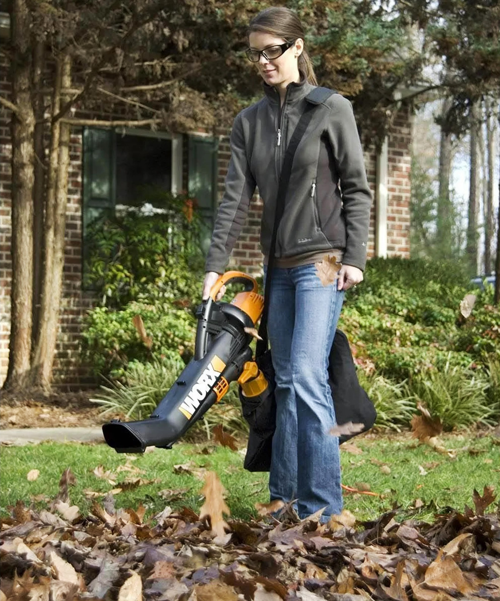 Woman uses work leaf blower