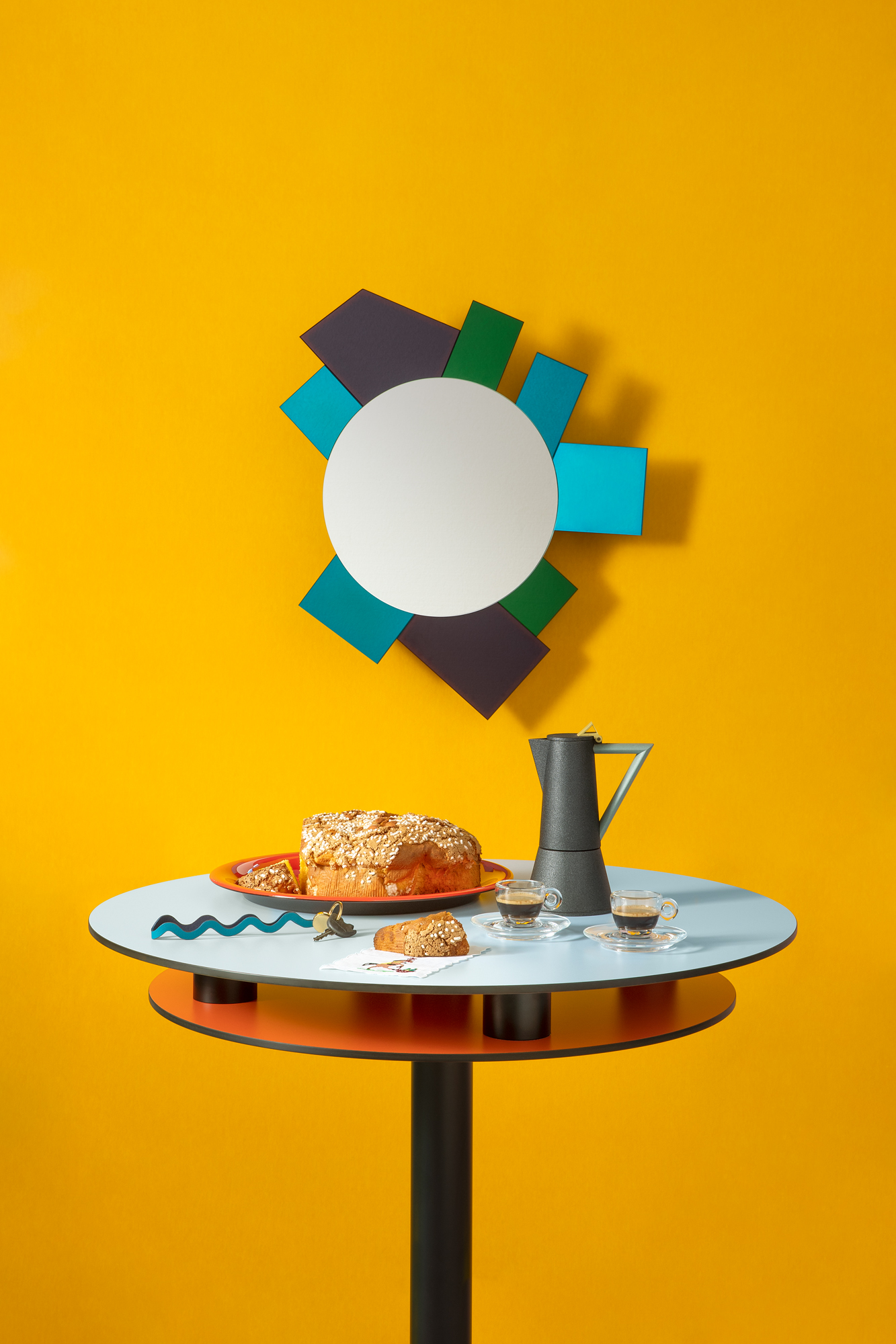 A coffee maker by Ettore Sottsass on a table with Colomba