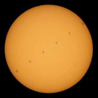 This composite image shows the International Space Station as it transits in front of the sun. Made up of six different frames taken from Fredericksburg, Virginia, this image shows the space station moving at approximately 5 miles per second on June 24, 2020. Five astronauts are currently onboard the space station, including Expedition 63 NASA astronauts Chris Cassidy, Douglas Hurley and Robert Behnken and Roscosmos cosmonauts Anatoly Ivanishin and Ivan Vagner.