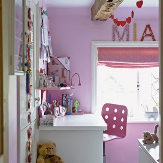 children's pink bedroom with white study table
