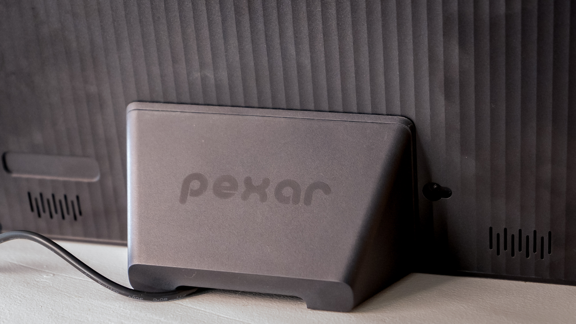 The stand behind a Lexar Pexar 11-inch photo frame