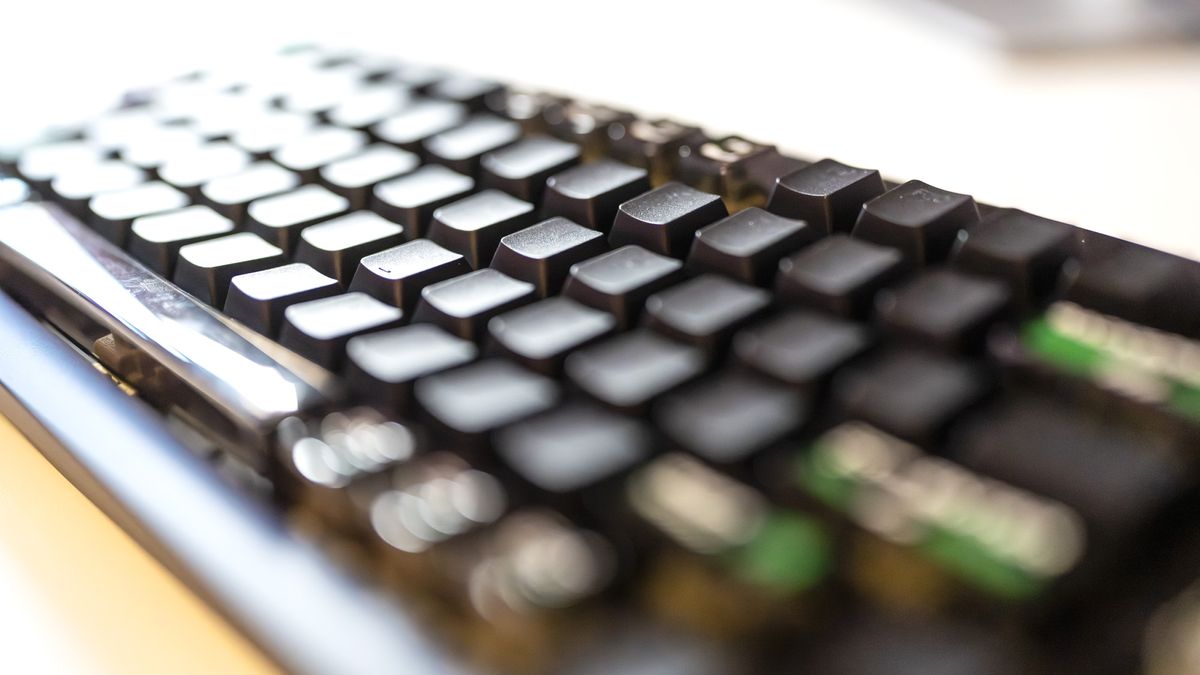 Lemokey L5 HE 8K gaming keyboard with RGB enabled on a desk.