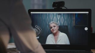 Sharon Gless on a computer screen as Zsa Zsa after Dylan calls her in America