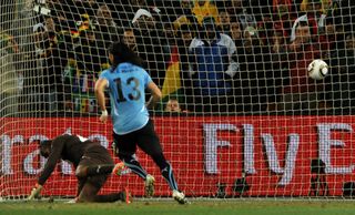 Uruguay's Sebastian Abreu scores a Panenka penalty past Ghana goalkeeper Richard Kingson to win the shootout for the South Americans in the quarter-finals of the 2010 World Cup in South Africa.