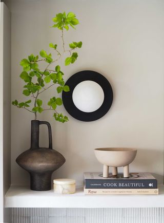 a wall light above a shelf