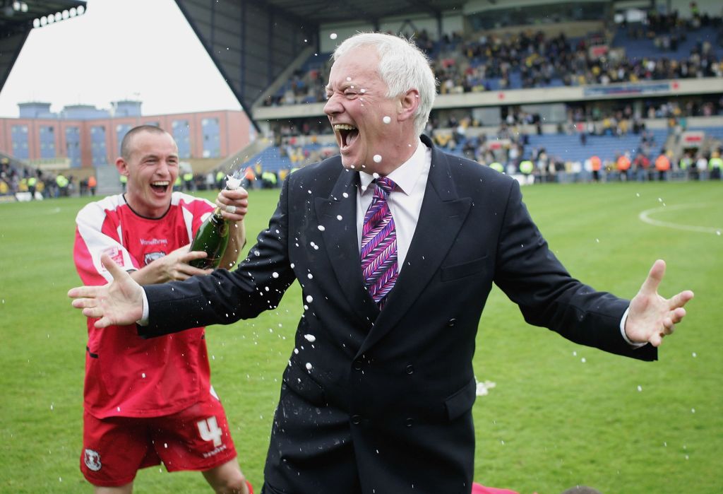 Leyton Orient chairman Barry Hearn is sprayed with champagne by Michael Simpson after the side's promotion from League Two in 2006