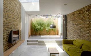 living room with bifold doors to small courtyard garden