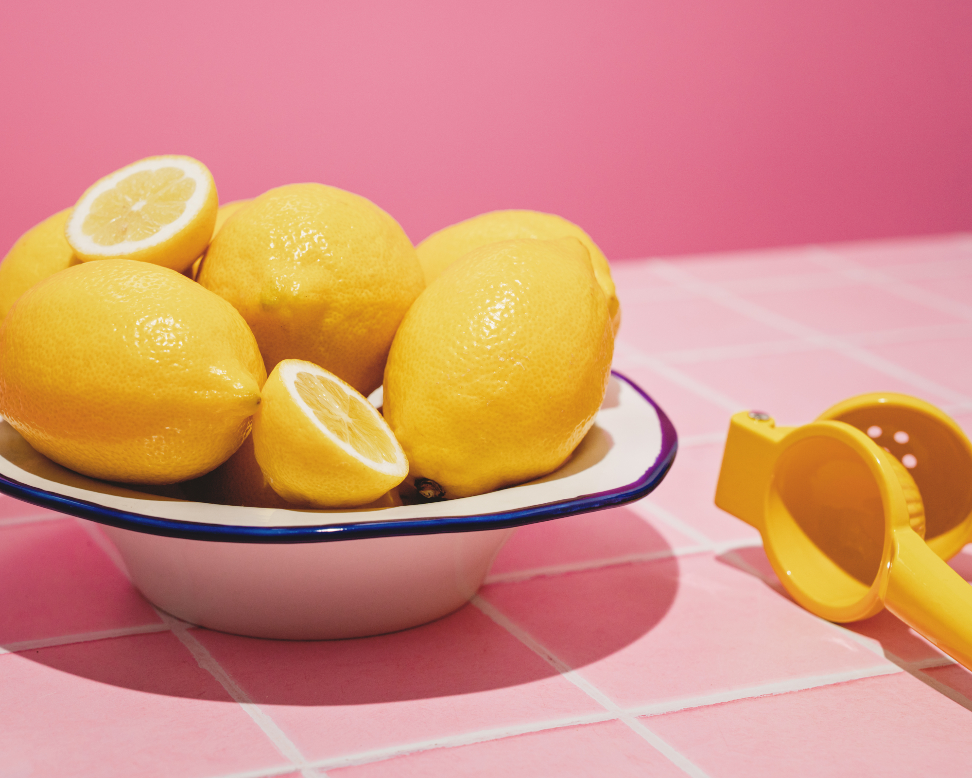 Bowl of lemons in pink kitchen