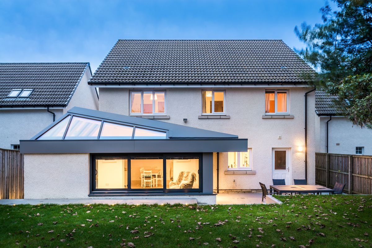 white rendered house with new rear extension