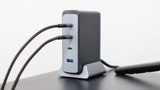 Anker Prime 240W GaN Desktop Charger on a black surface in front of a white wall