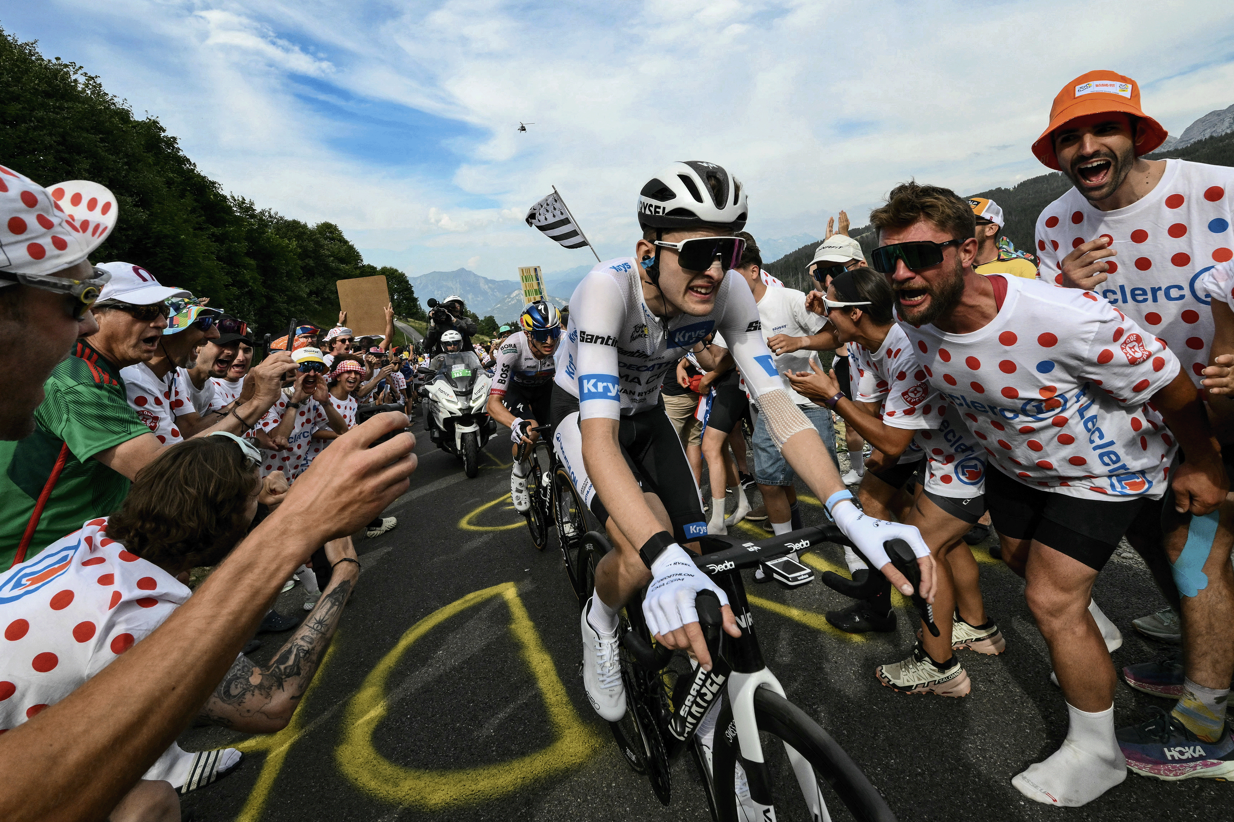 French rider Paul Seixas cycles in the final ascent of the 15th stage of the 113th edition of the Tour de France cycling race, through mass crowds to Plateau de Solaison on July 19, 2026