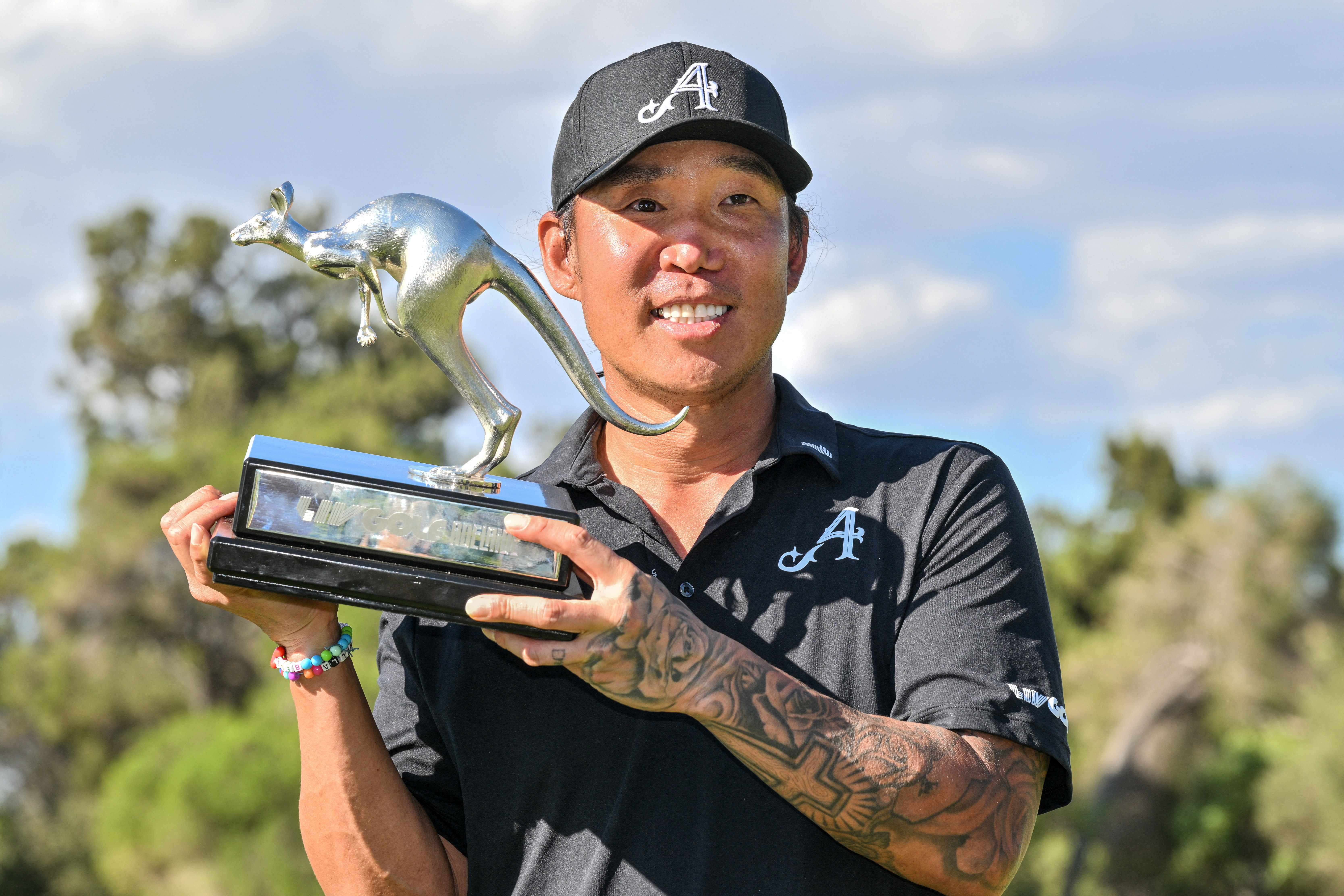 Anthony Kim poses with the LIV Golf Adelaide trophy