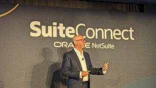 Evan Goldberg, EVP and founder at NetSuite speaking on stage at Oracle NetSuite SuiteConnect London 2024.