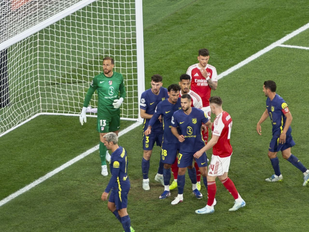 A Champions League soccer match between Arsenal and Atletico Madrid, as seen from the upper stand at the Emirates stadium, London. Zoomed in photos of the players