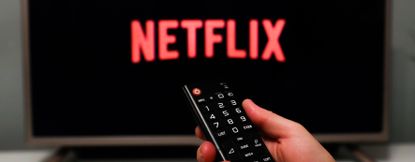 Netflix logo is seen displayed on a tv screen