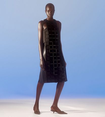 Shrug; shirt; trousers; shoes, all by Prada. Minimalist womenswear for S/S 2021