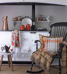 aga with teapots and cushions