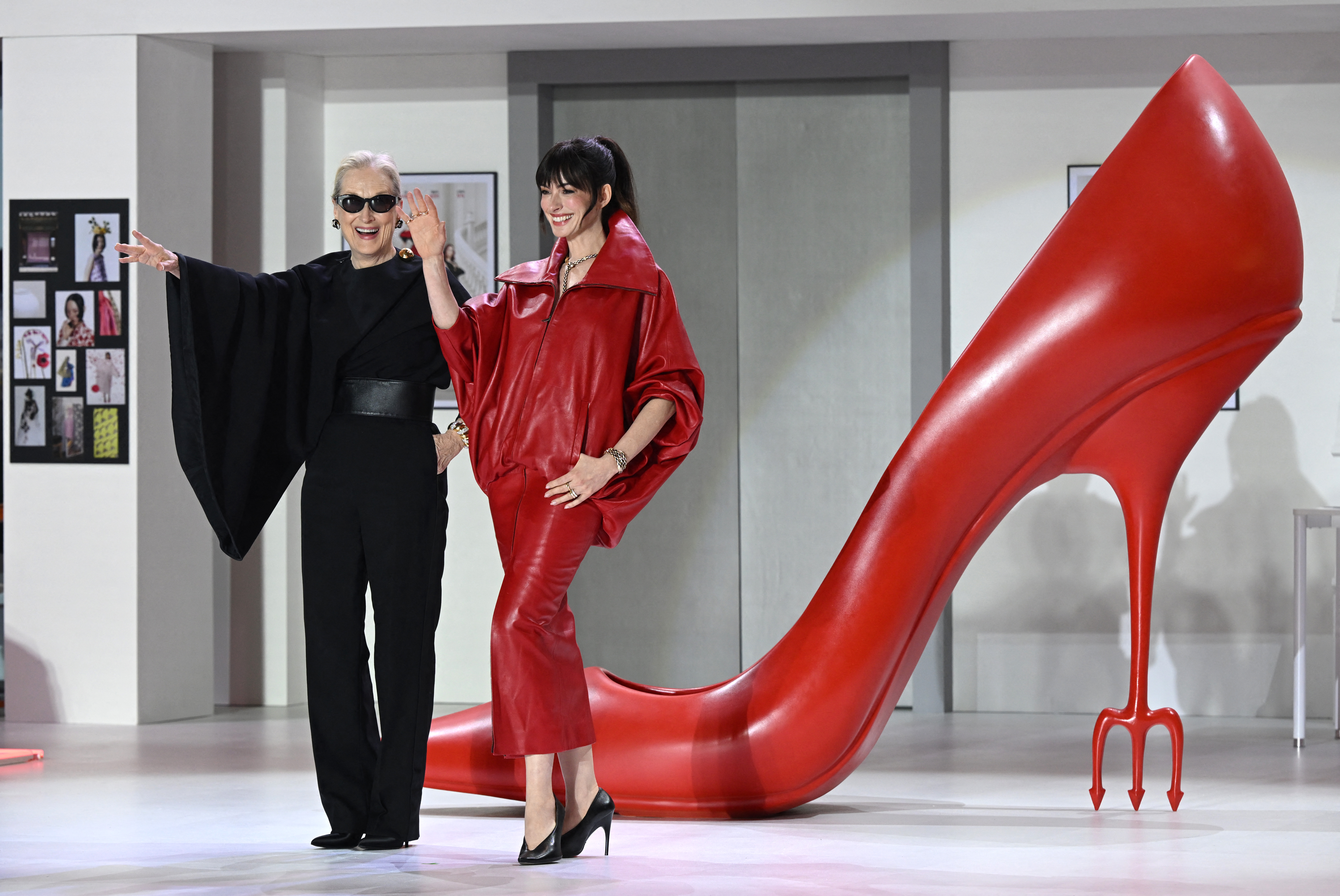 Anne Hathaway attended a 'Devil Wears Prada 2' event in a red leather Balenciaga skirt set