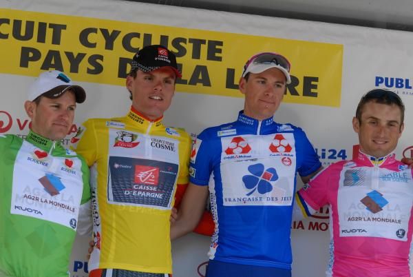 The jersey winners and stage winner appear on the podium.