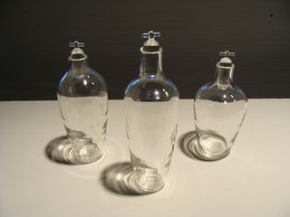 Three clear glass carafes