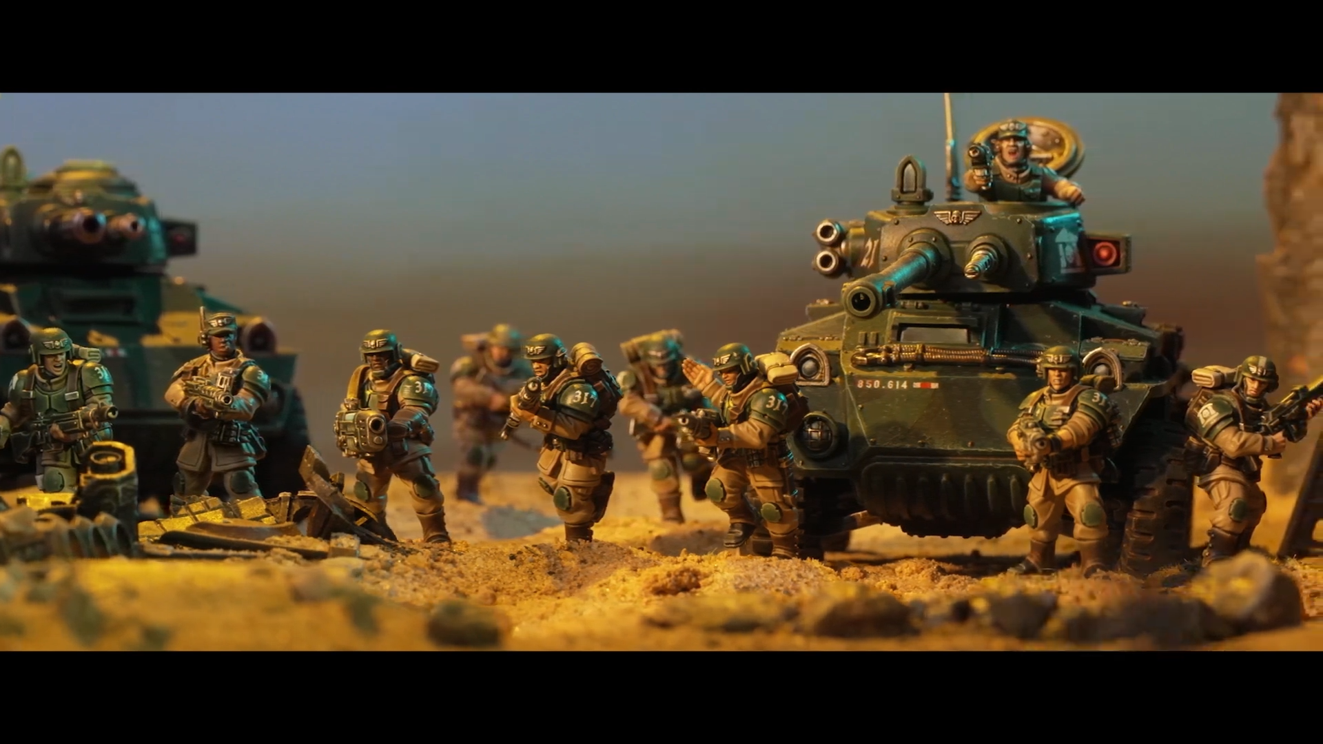 Warhammer miniatures posed against terrain and other models