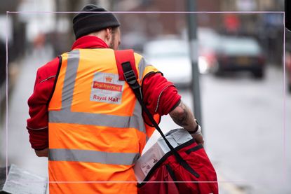 the back of a Royal Mail postman walking and delivering post